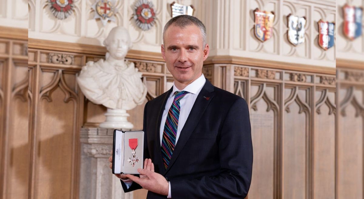 Gareth Hetherington receiving his MBE medal